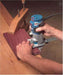 A man holding the 71mm Bosch Colt Router